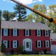 The Regal Tree crane removing a tree near a home in Millis, MA.